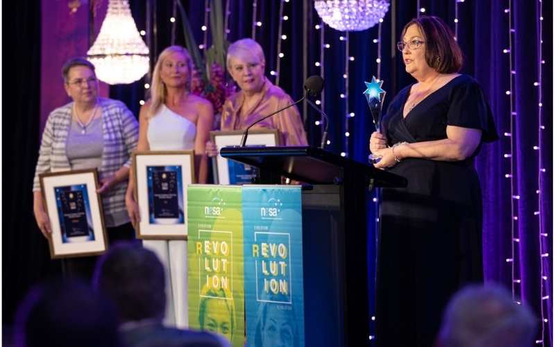 Angie’s Domestic Duties founder Angela Brown accepts her Champion Employer award. Photo: Photox