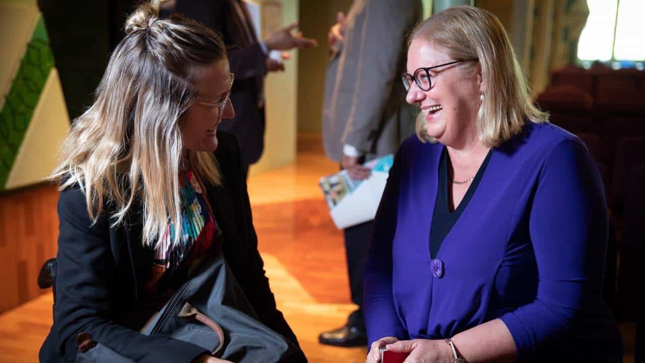 two women smiling